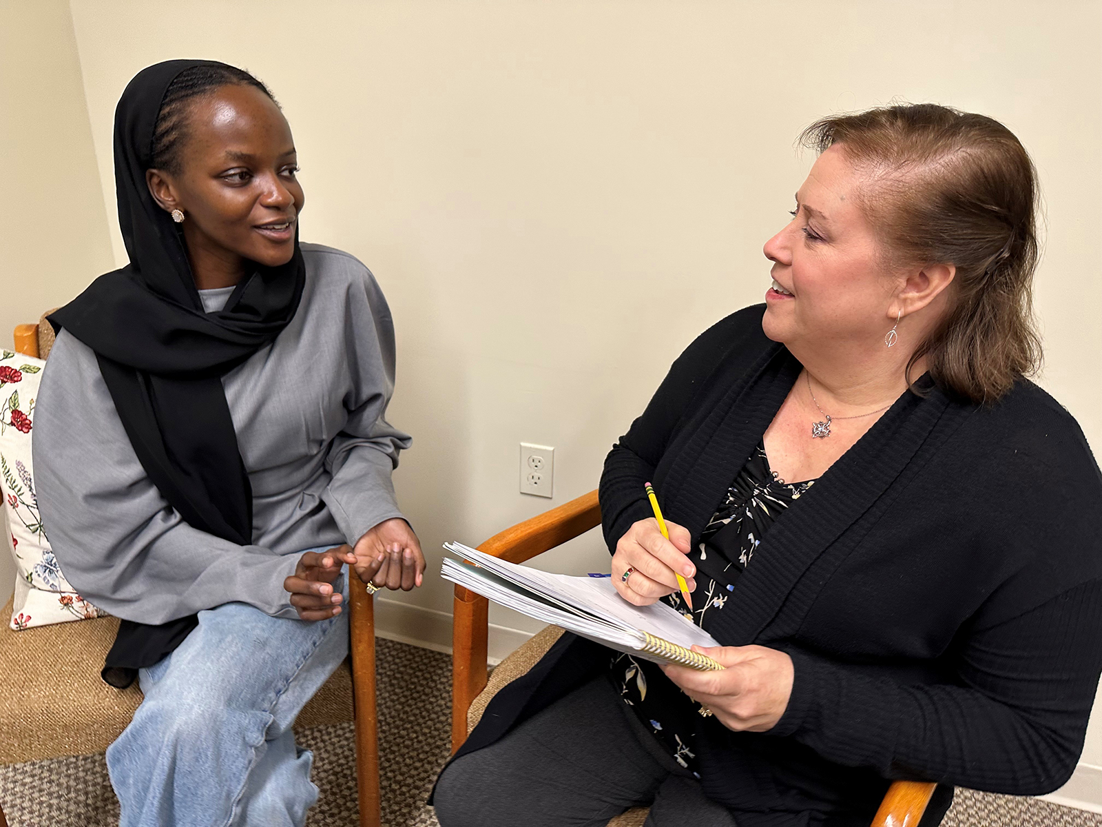 A small business owner chats with a member of the CEDF team.